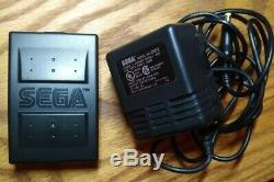 Sega Nomad handheld console with original plastic still on screen, Working
